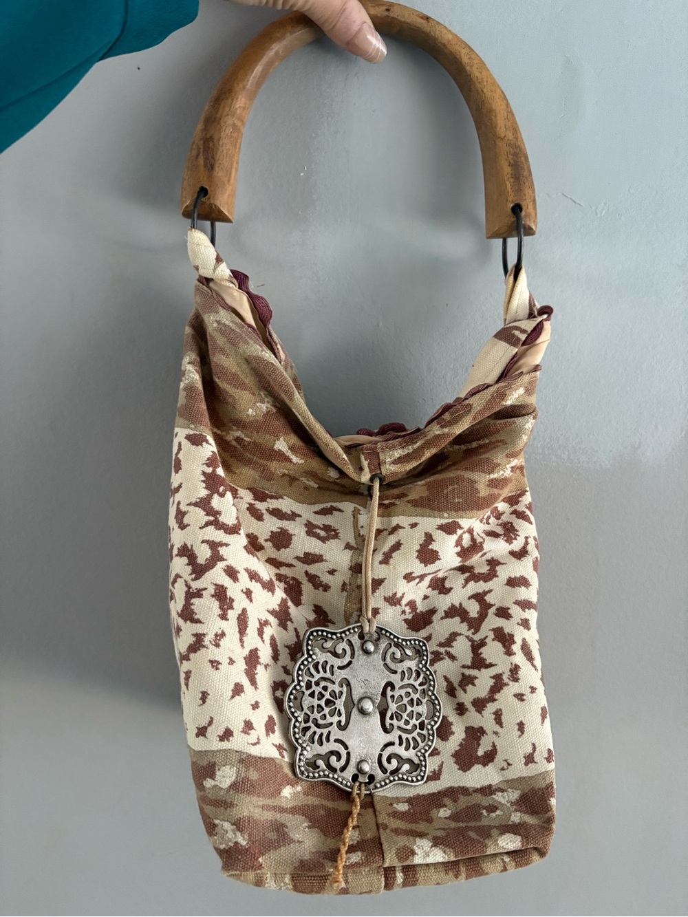 Vintage Neutral Animal-Print Hobo Bag with Wooden Handle and silver emblem